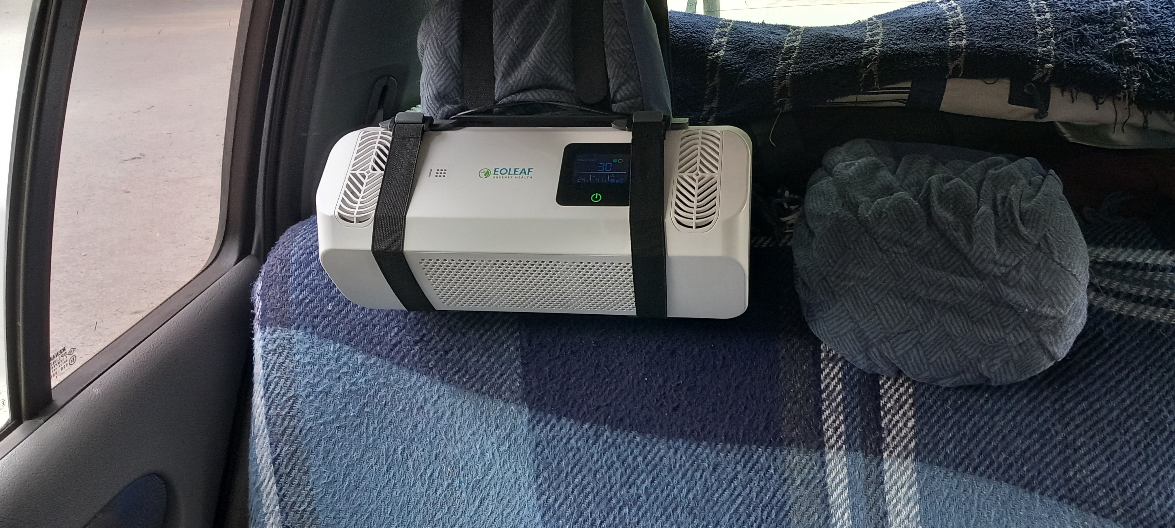 Eoleaf's Pure CAR air purifier attached to a headrest