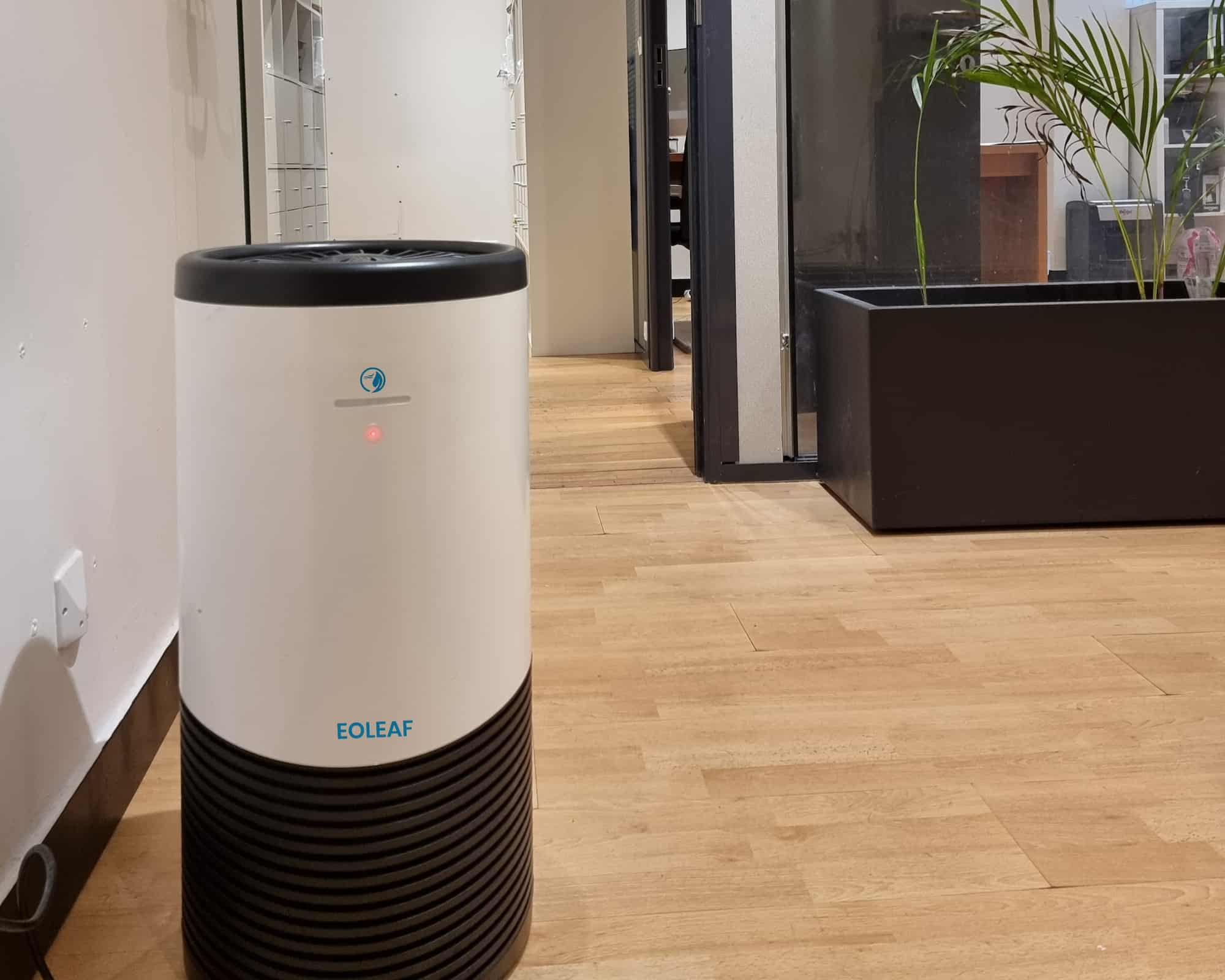 Eoleaf's AEROPRO 100 air purifier in an open office with wood floors