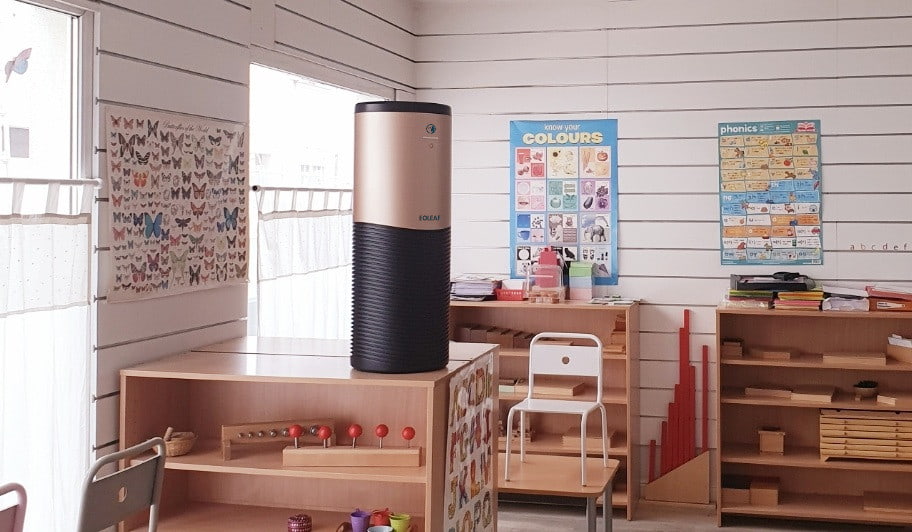 Eoleaf's AEROPRO 150 air purifier in a classroom on a desk