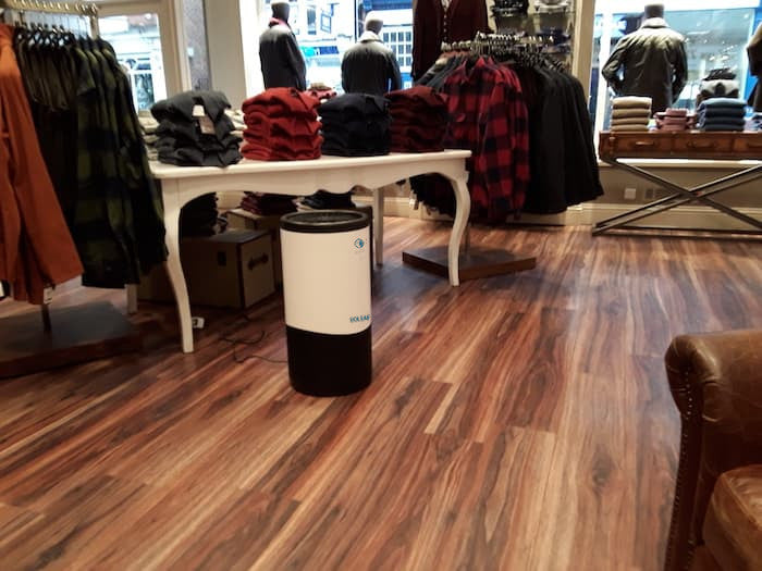 Eoleaf's AEROPRO 150 air purifier in a clothing store