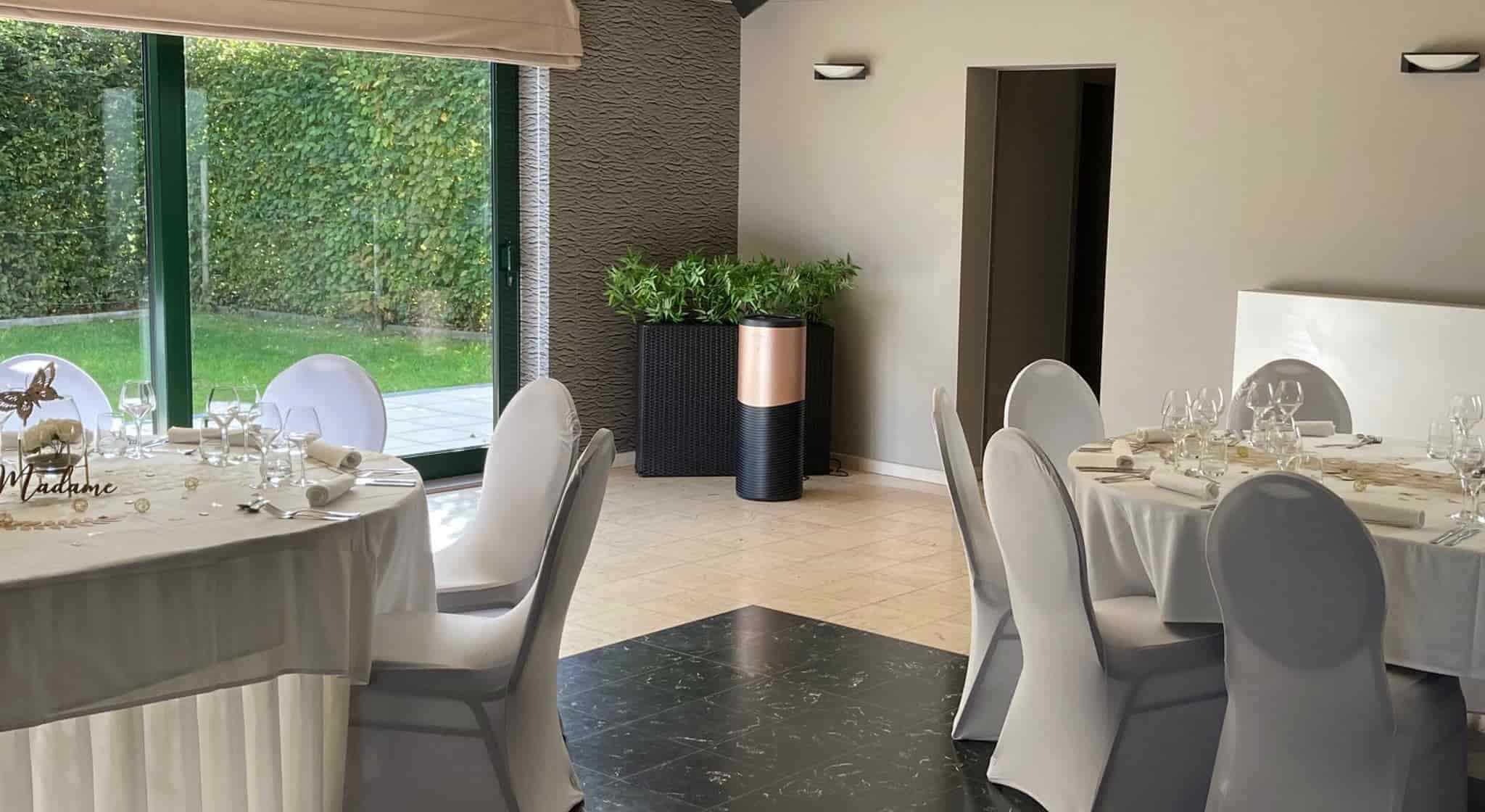 Eoleaf's AEROPRO 150 air purifier in a reception hall with white chairs