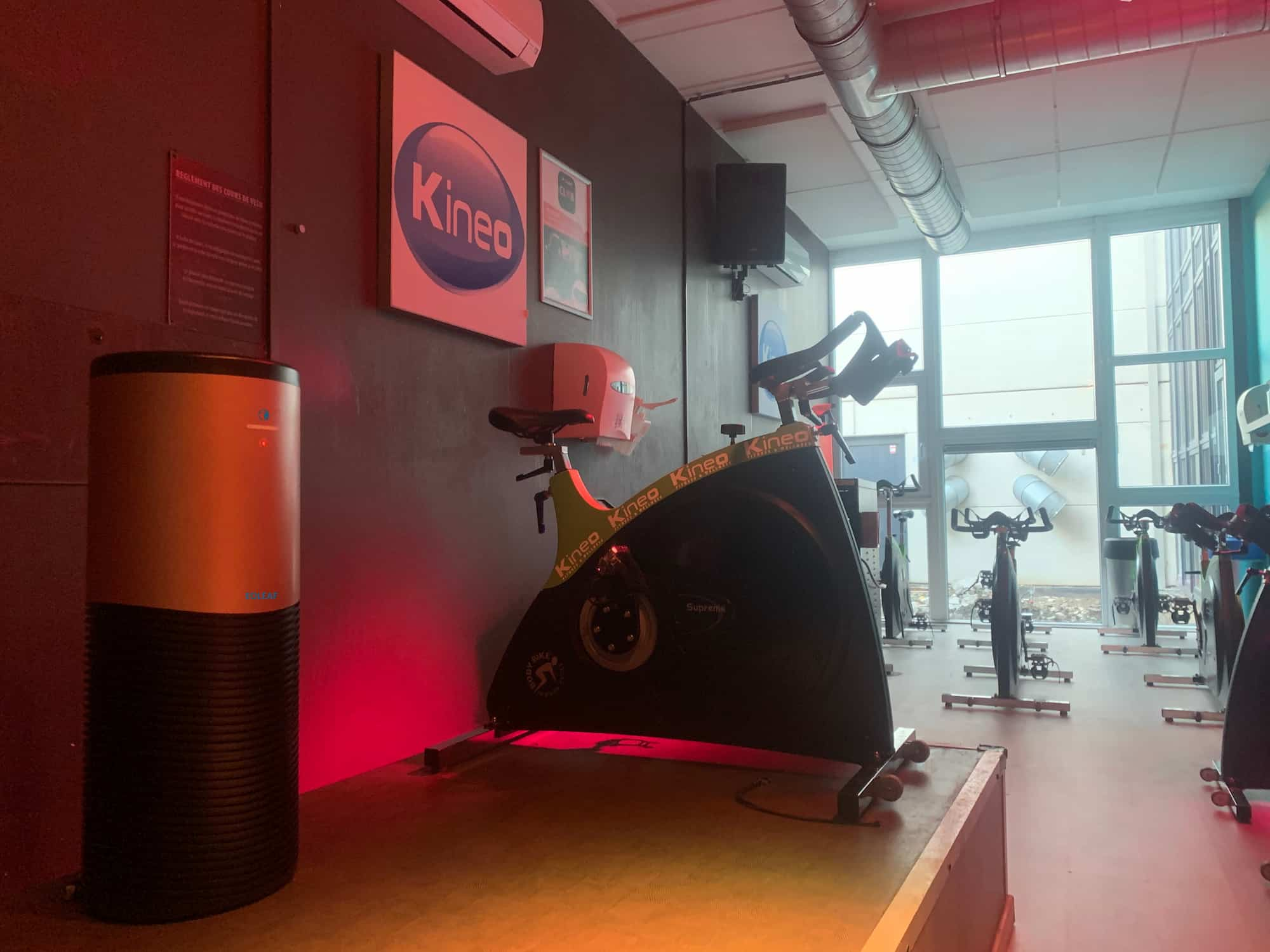 Eoleaf's AEROPRO 150 air purifier next to exercise bikes in a gym